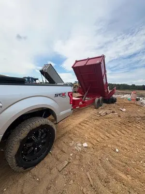 Dump trailer being raised at a job site